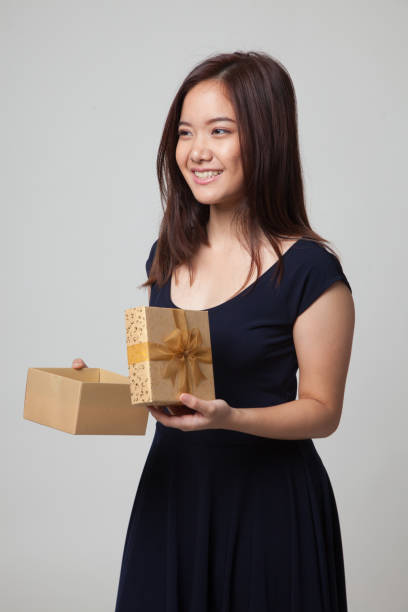 istock Young Asian woman open a gift box. 679241898