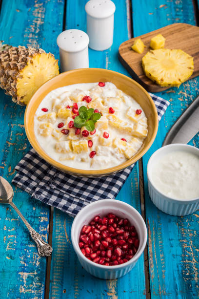 ananas or anaanaas or pineapple raita, chopped pieces of pineapple mixed with sweet curd and garnished with pomegranate and mint, favourite side dish or starter food in India ananas or anaanaas or pineapple raita, chopped pieces of pineapple mixed with sweet curd and garnished with pomegranate and mint, favourite side dish or starter food in India ananas stock pictures, royalty-free photos & images