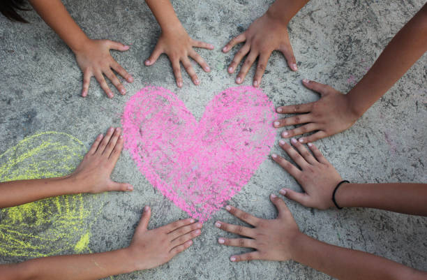 istock Pink heart drawing with children hand surround 679255880