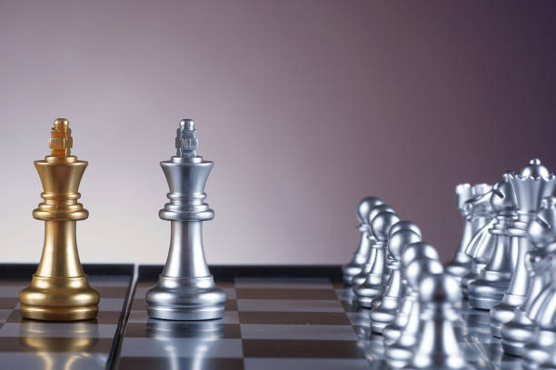 istock Silver king facing golden king set of chess on gradient background - leadership, team, successful and business concept 679269858
