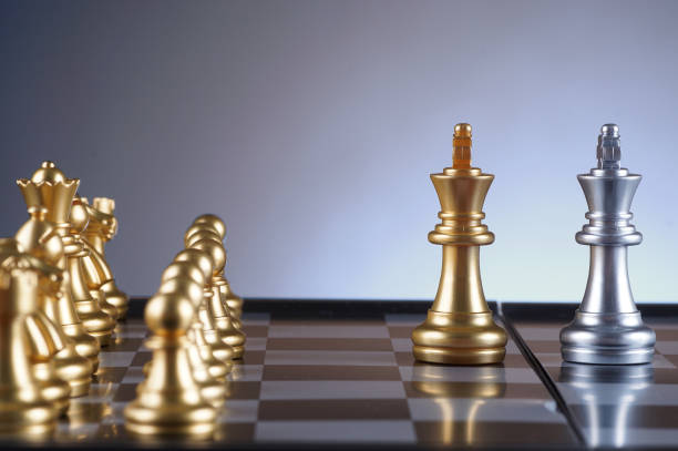 istock Golden king facing silver king set of chess on gradient background - leadership, team, successful and business concept 679270026