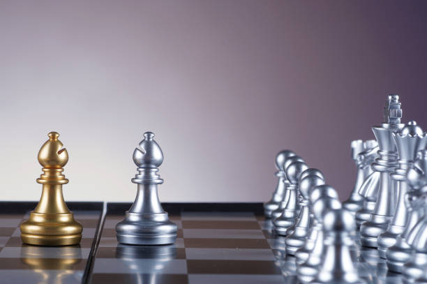 istock Silver knight facing golden knight set of chess on gradient background - leadership, team, successful and business concept 679270126