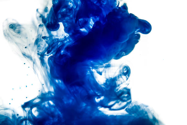 istock blue ink in water isolated on white background 679270362