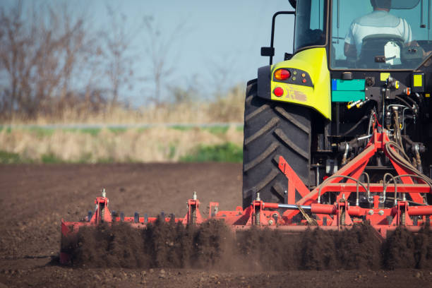 istock Farmer in tractor preparing land with seedbed cultivator 679274124