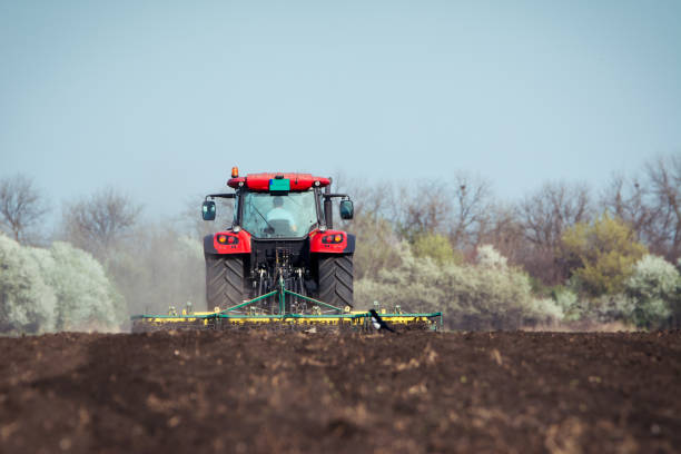 istock Farmer in tractor preparing land with seedbed cultivator 679274672