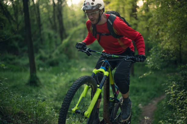 istock Sport man, mountain biker, rideing a cycle in forest. Down hill ride. 679293718