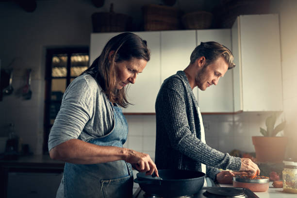 istock Like mother like son in the kitchen 679294804