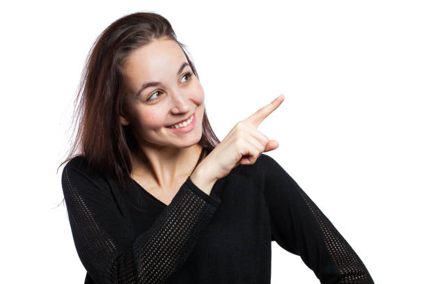 istock Young woman pointing up 679297738