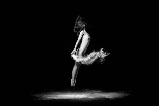 istock Beautiful ballet dancer, dancing with powder on stage 679301144