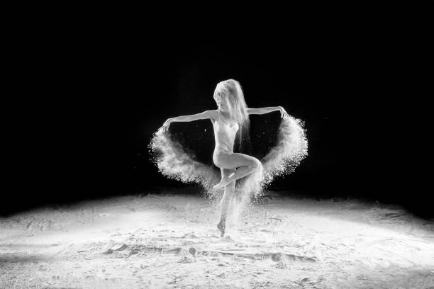 istock Beautiful ballet dancer, dancing with powder on stage 679301158