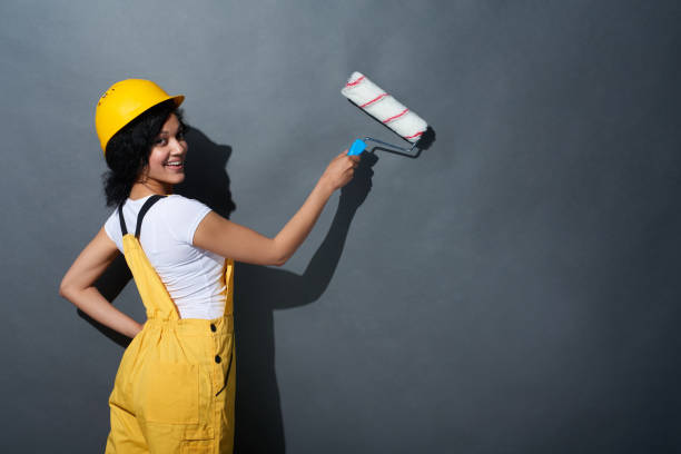 istock Happy smiling woman builder wearing yellow protect helmet 679301994