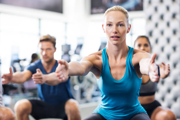istock Woman exercising in gym 679305374