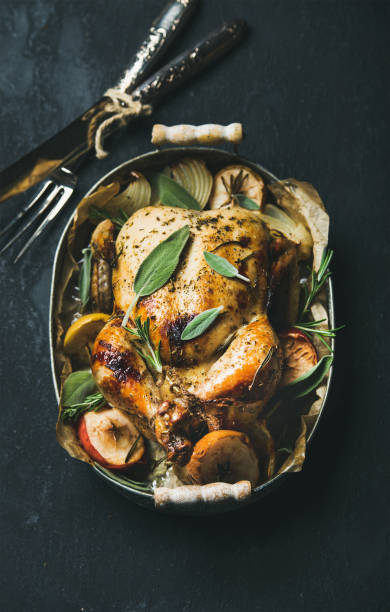 istock Oven roasted whole chicken in serving tray 679327548