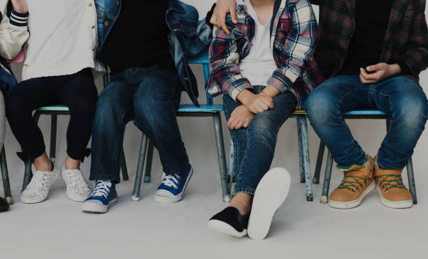 istock Group of Students Sitting on The Chairs on White Blackground 679345924