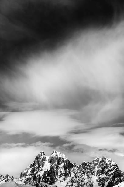 istock Black and white Mounts Ushba and Chatyn in windy sunny day 679353366