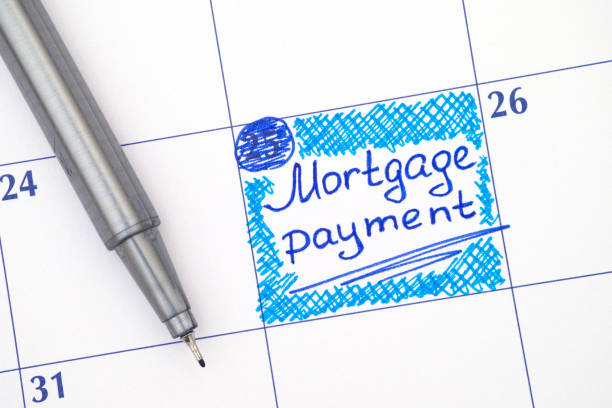 Reminder Mortgage Payment in calendar with blue pen stock photo