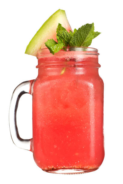 istock Refreshing drink in a jar mug on a white background. Cocktail with watermelon juice and a slice of watermelon and mint as a decoration. 679361890
