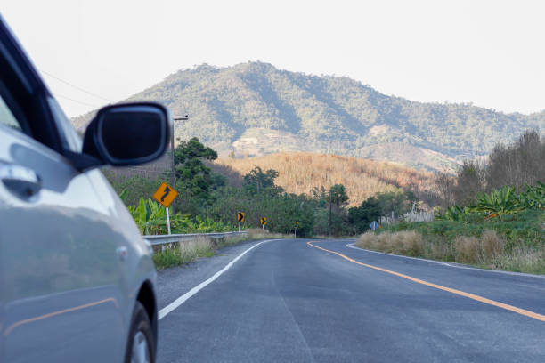 istock car and street with mountain landscape 679365670