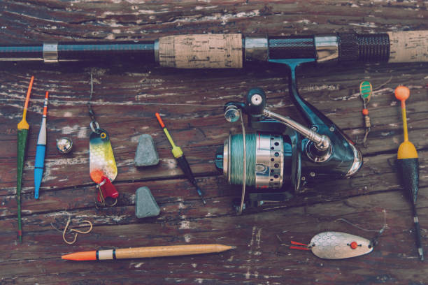 istock vintage fishing equipment on rustic plank 679378162