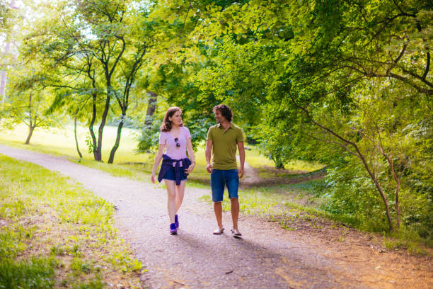 istock Young couple spending time together in nature on hot summer day 679399772