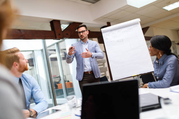 istock Businessman presenting new project to partners in the office. 679399802