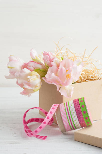 istock Fresh pink tulip flowers in gift kraft box 679405992