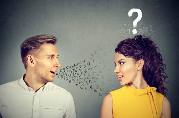 istock Man talking to an attractive woman with question mark 679415368