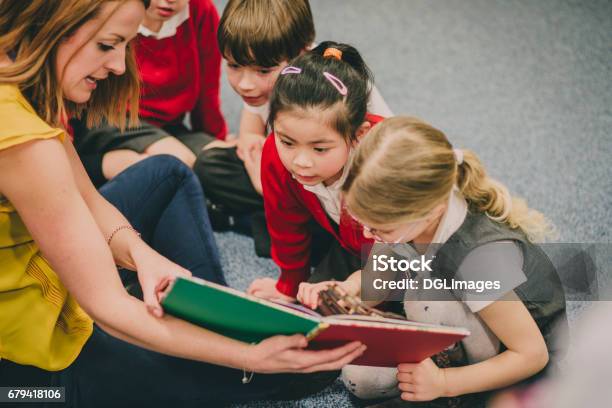 Storytime In The Classroom Stock Photo - Download Image Now - Storyteller, Reading, Storytelling