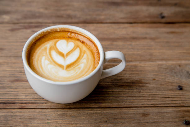 istock cup of coffee on wood table blackground 679419054