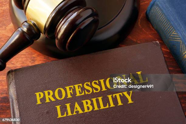 Book With Title Professional Liability And Gavel Stock Photo - Download Image Now - Analyzing, Backgrounds, Business