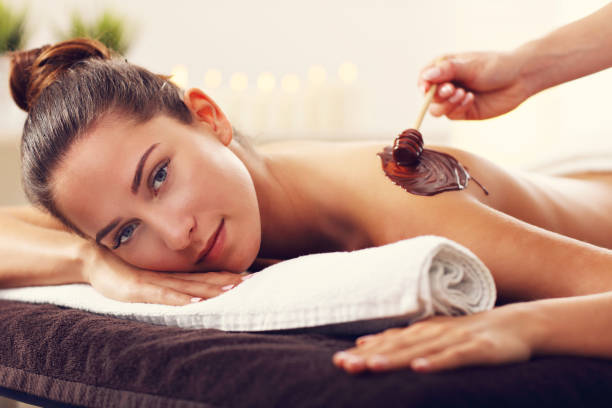 istock Beautiful woman getting chocolate massage in spa 679438044