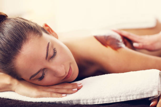 istock Beautiful woman getting chocolate massage in spa 679438220