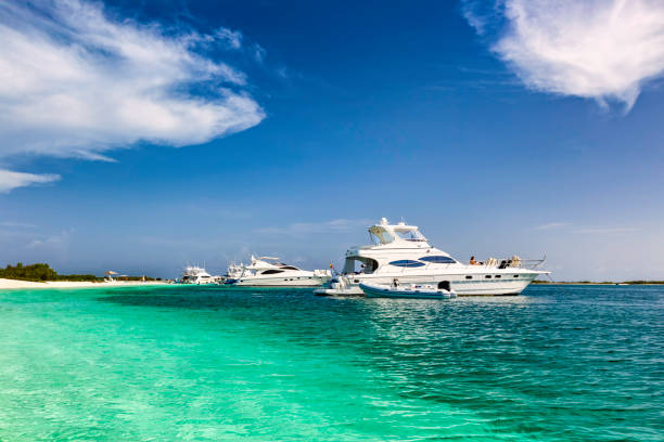 istock Luxury Yachts anchored in a tropical exotic island beach 679451482