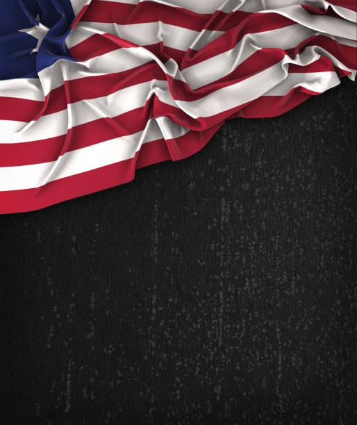 istock Liberia Flag Vintage on a Grunge Black Chalkboard With Space For Text 679453328