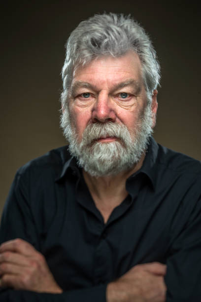 istock Senior portrait. Real man with beard, looking straight in camera 679454166