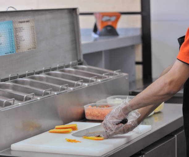 istock cooking in fast food restaurant 679460486