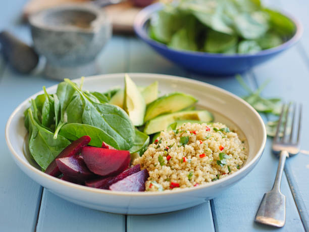 Home made freshness coriander red chilli quinoa with spinach,avocado and poached beetroot bowl.