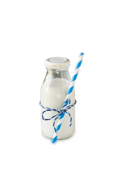 istock Milk bottle with striped straw isolated on white background 679462096
