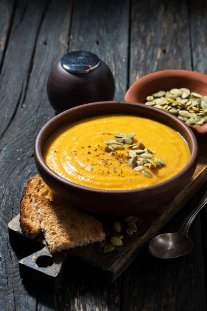 istock pumpkin soup with toasts on wooden table 679468660