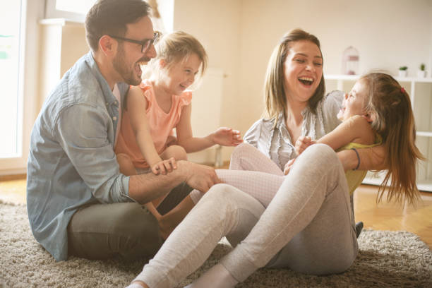 istock Cheerful family with two child spending time at home. 679468678