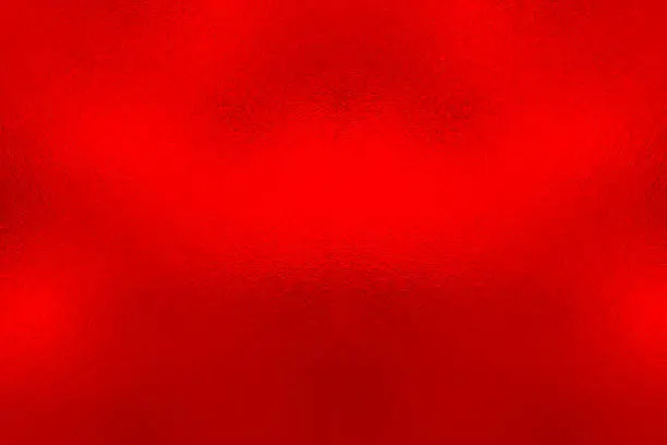 Photo of Red foil background, metal texture