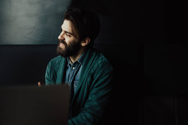 istock Handsome bearded man in the bar looking through the window 679479538
