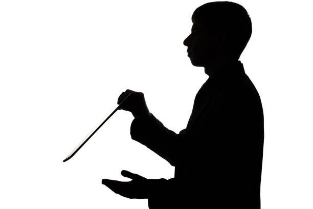 istock Silhouette of a man with a folder in hands 679486342