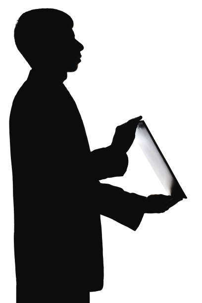 istock Silhouette of a man with a folder in hands 679486928