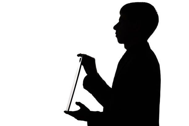 istock Silhouette of a man with a folder in hands 679487002
