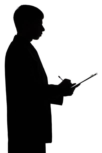 istock Silhouette of a business man signing a document 679487094