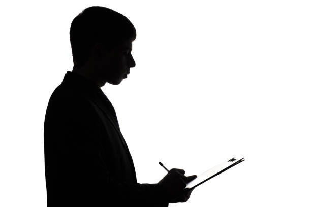 istock Silhouette of a business man signing a document 679487206