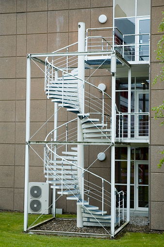 Metal spiral staircase on the outside of an office building