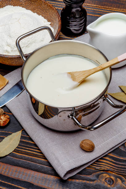 istock bechamel sauce in a pan and ingredients 679505246