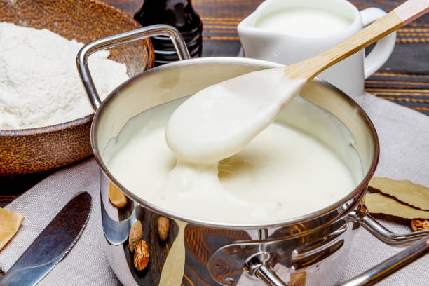 istock bechamel sauce in a pan and ingredients 679505364